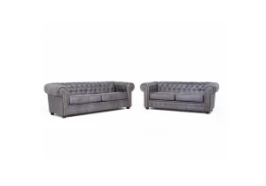 The Astor 3+2 grey sofa set in a living room, featuring a 3-seater and 2-seater with Chesterfield-style deep button tufting and sparkling diamante accents.