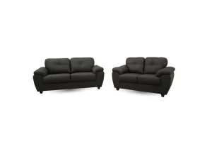 The modern Capri 3+2 seater sofa set in Soft Black faux leather, showing the elegant quilted back cushions and uniquely shaped padded armrests.
