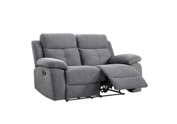 The Caro two-seater manual recliner loveseat in versatile grey fabric, showcasing its lever-activated reclining mechanism.