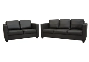 A modern living room with the compact Cube sofa set, featuring a faux leather three-seater and two-seater with large, plush back cushions.