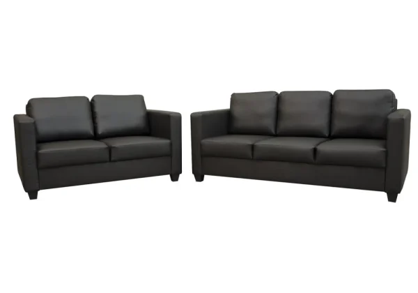 A modern living room with the compact Cube sofa set, featuring a faux leather three-seater and two-seater with large, plush back cushions.